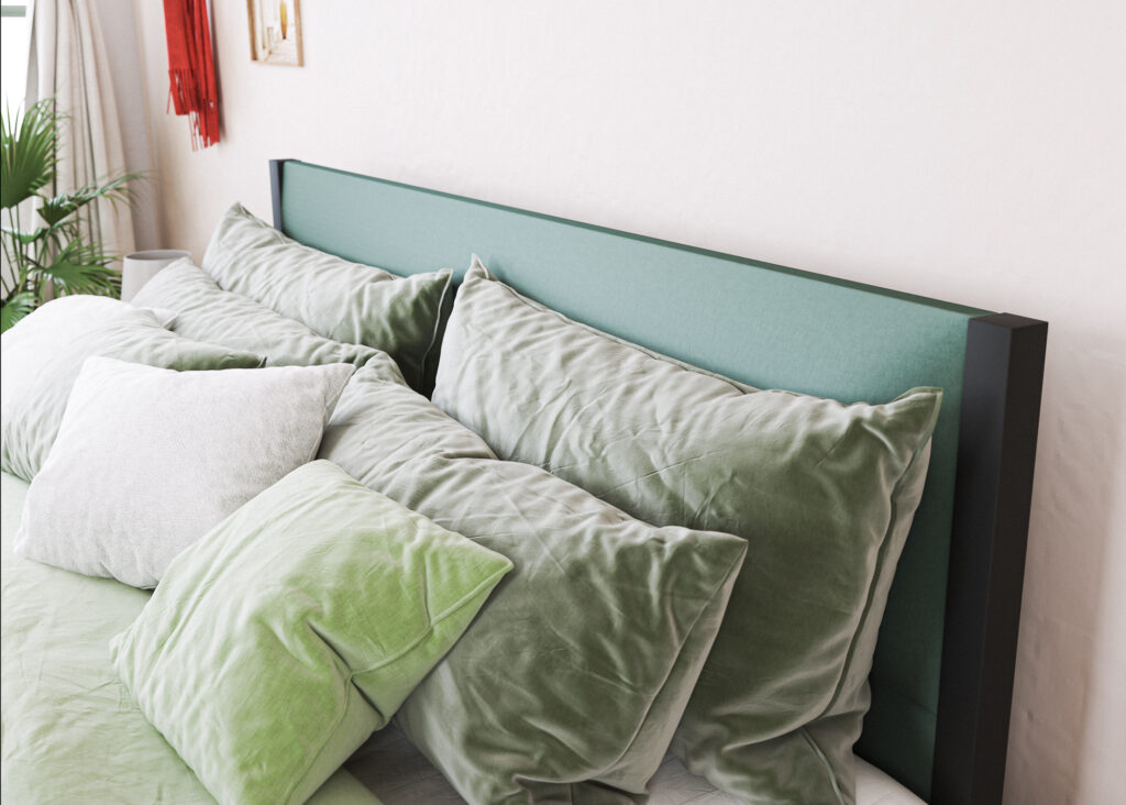 The striking Genoa square framed upholstered iron bed. Close up with green cushions