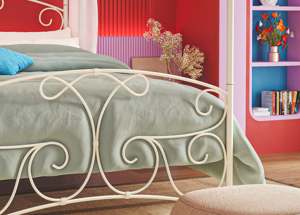 our Lyra white iron bed in a colourful room - detail view